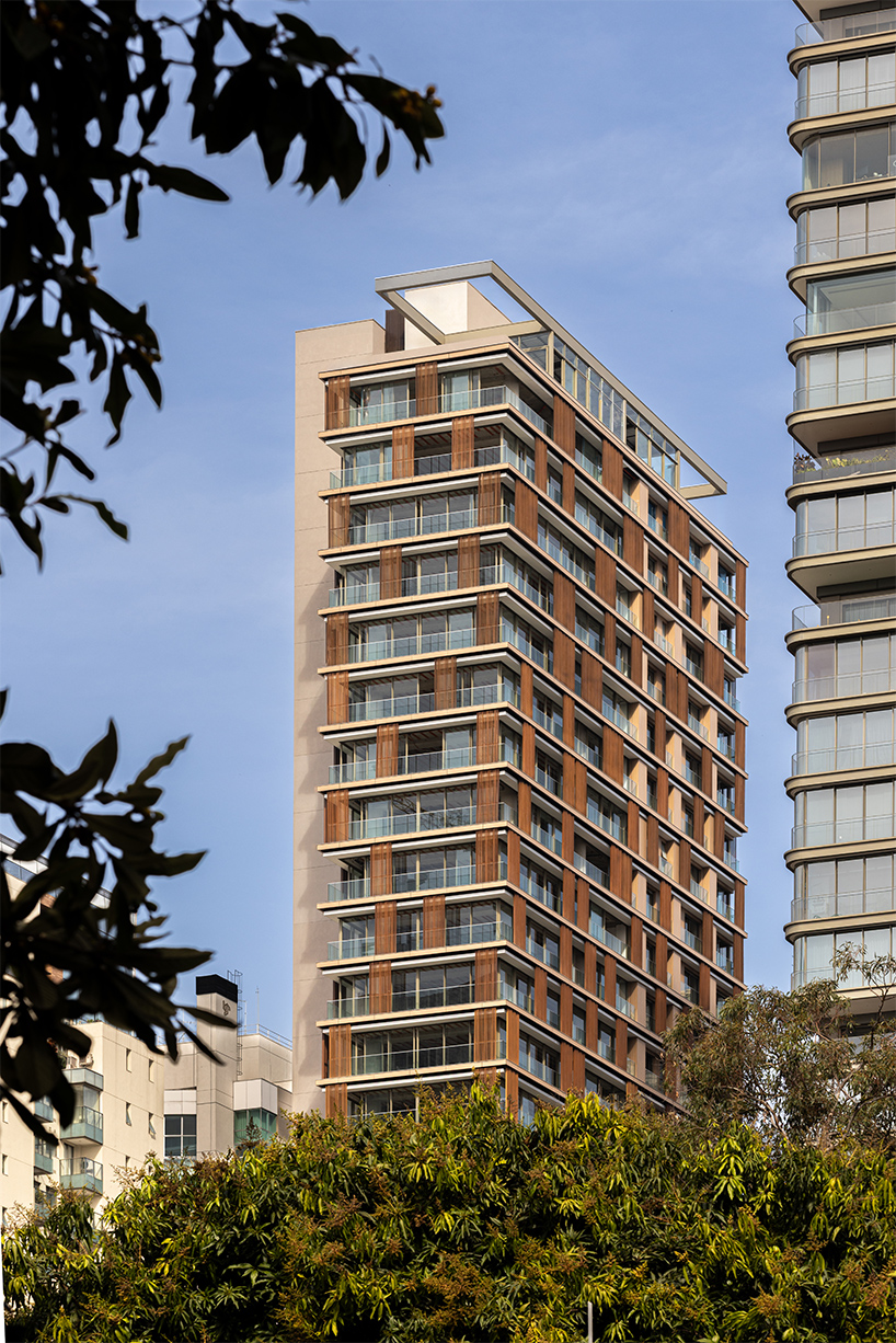 kinetic wooden panels run across residential tower's facade by perkins&will in s&atilde;o paulo