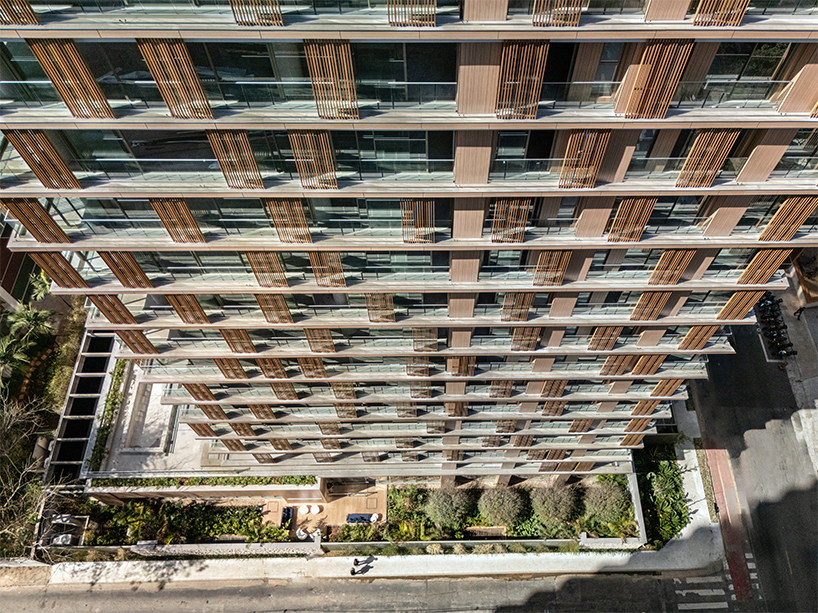 kinetic wooden panels run across residential tower's facade by perkins&will in s&atilde;o paulo