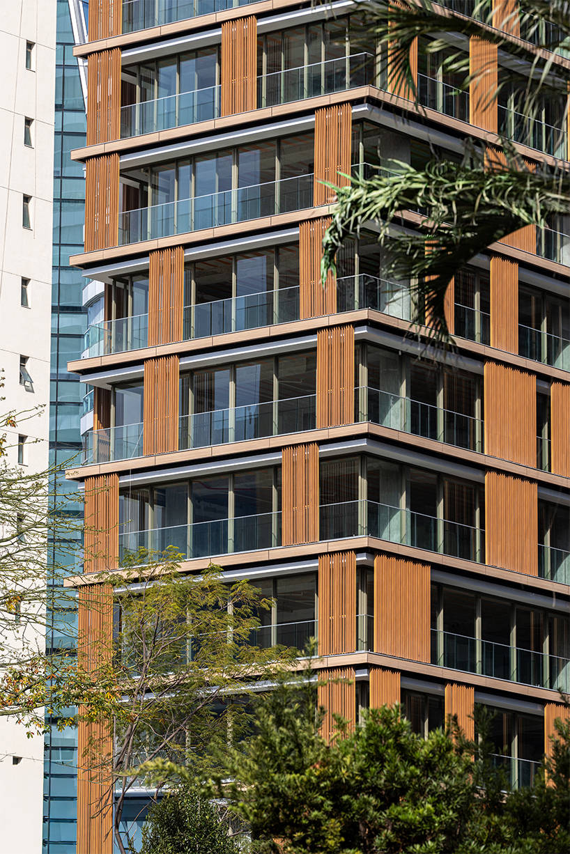 kinetic wooden panels run across residential tower's facade by perkins&will in s&atilde;o paulo
