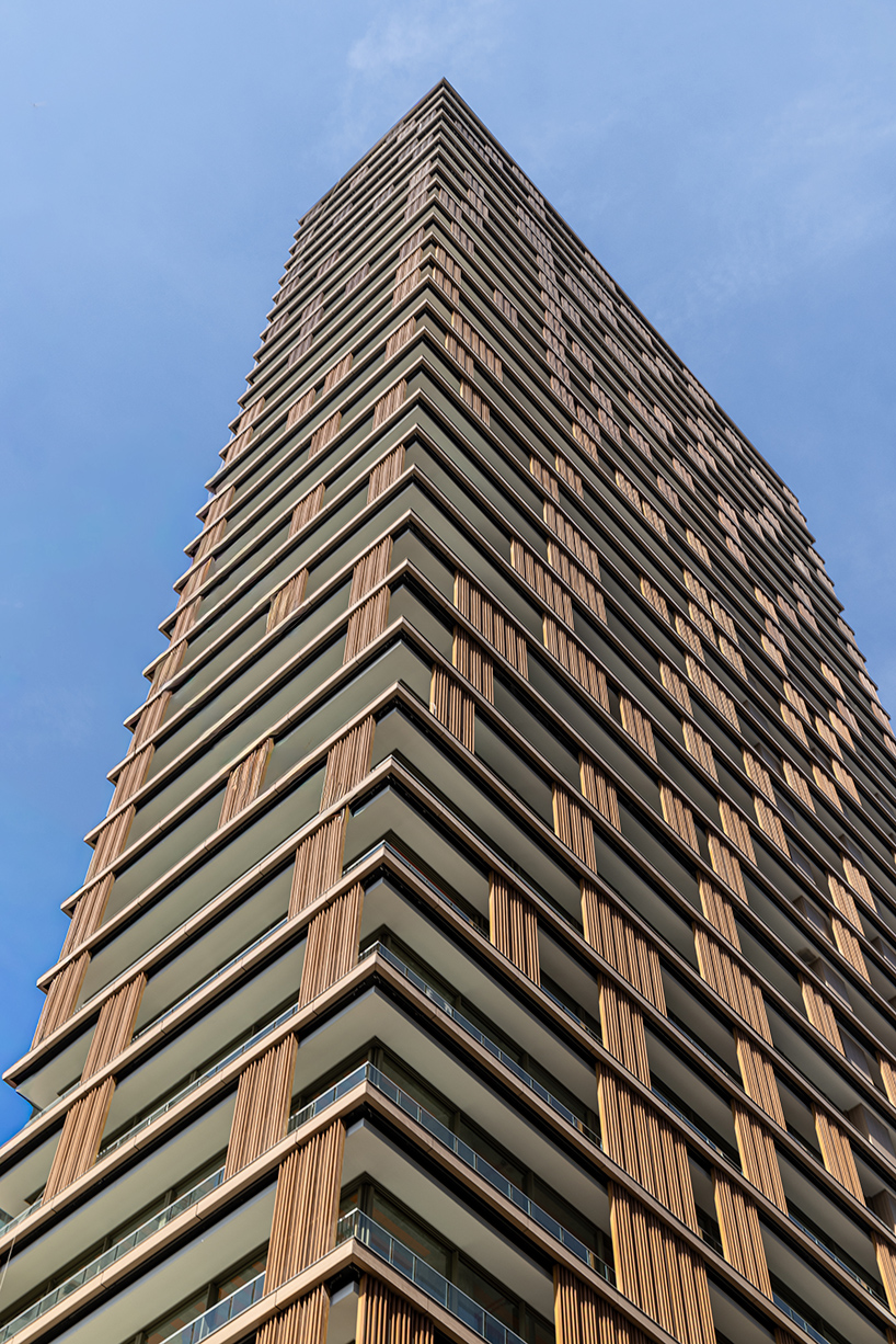 kinetic wooden panels run across residential tower's facade by perkins&will in s&atilde;o paulo