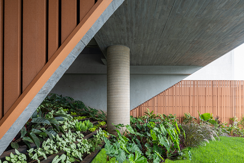 layered concrete facades and tropical vegetation shape maya tower by perkins&will in brazil - 7