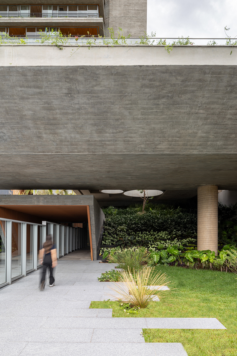 layered concrete facades and tropical vegetation shape maya tower by perkins&will in brazil - 6