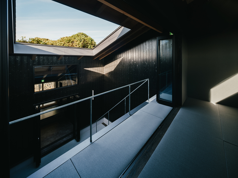 charred cedar facade enfolds kiln-inspired sauna in japan
