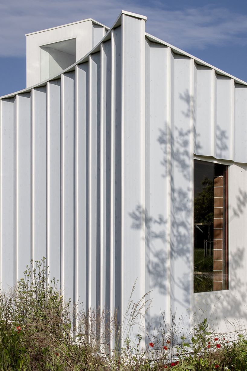 daniel holfeld captures gardeners house's pleated facade by cabinet studio in geneva