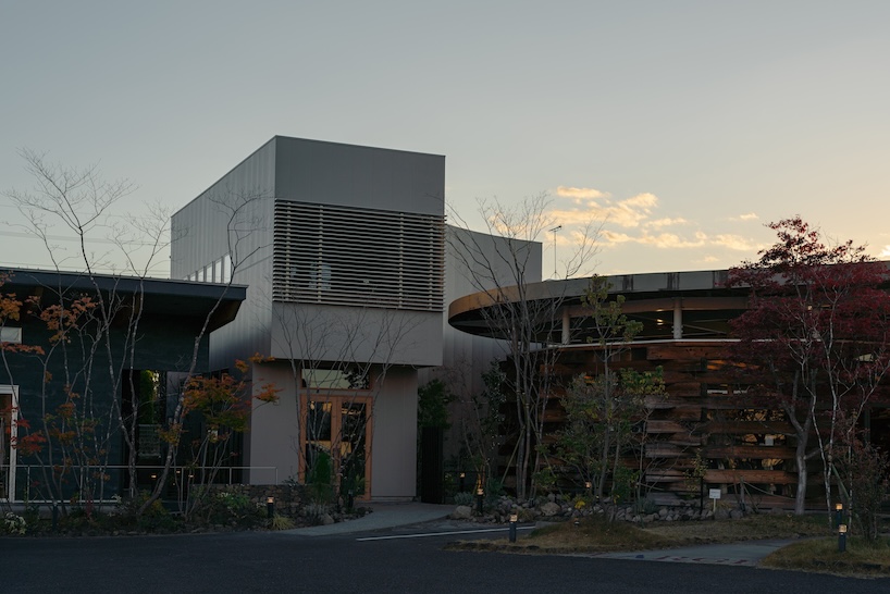 architrip's retail space curves between two existing shops in fukushima