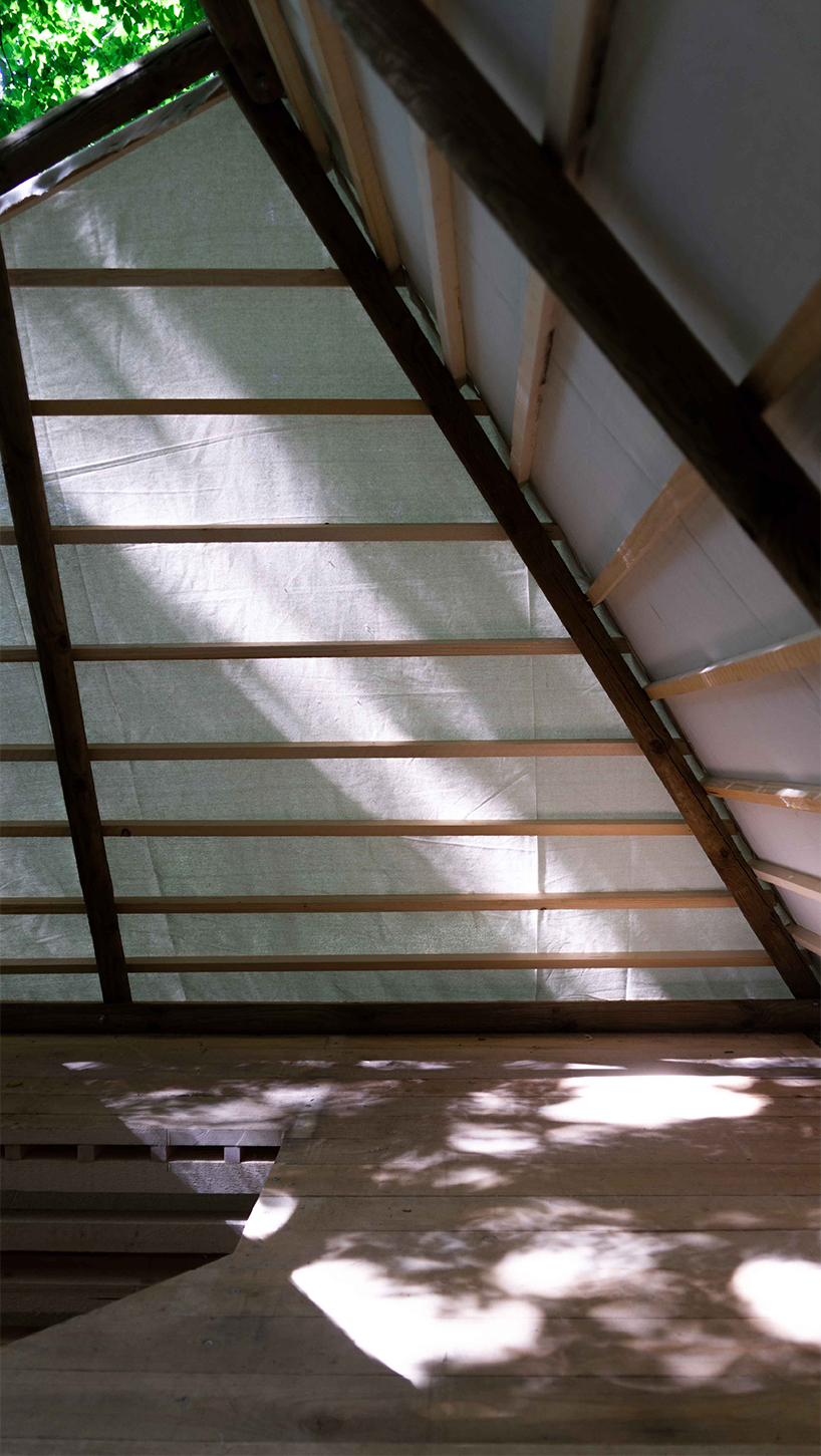 meaningless architecture's meditation cabin lights up like a lantern in french woodlands