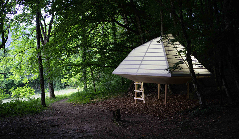 meaningless architecture's meditation cabin lights up like a lantern in french woodlands