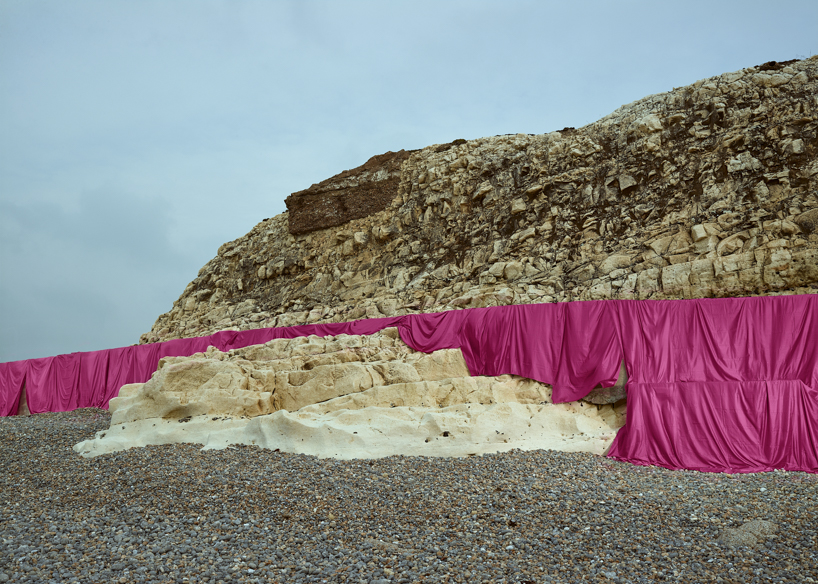 vibrant fabrics drape over chalk cliffs highlighting rock erosion of coastal landscapes