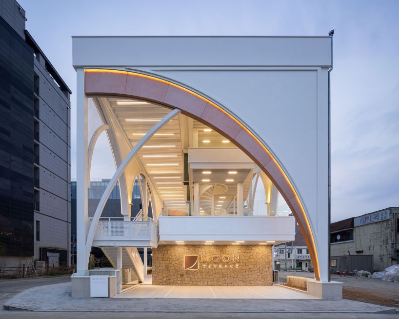 external arched metal skin forms around arcline architects' moon terrace in south korea