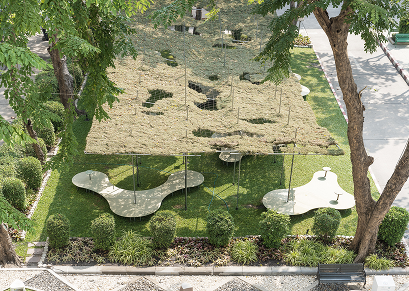 people pavilion's decomposed grass canopy shades over free-form circular seating