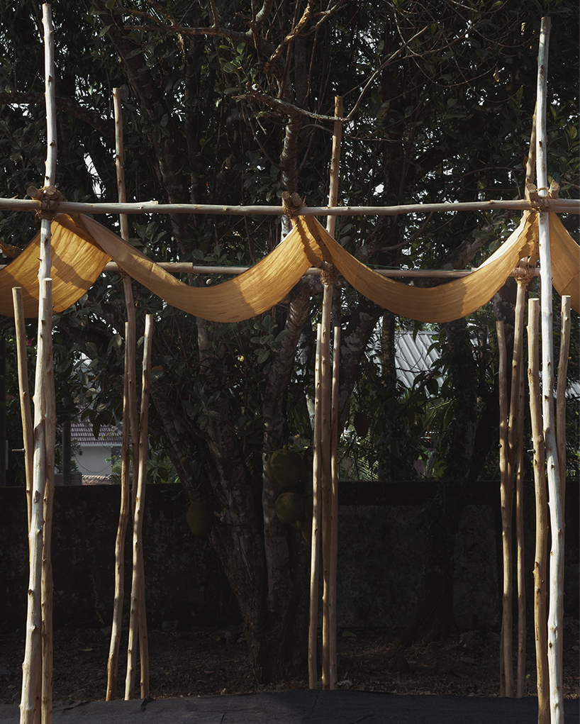 tensile fabric weaves through studio terratects' wooden trestle ...