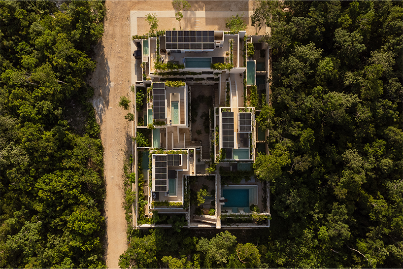 stacked chukum & stone volumes wrapped in green terraces shape RA!'s residences in tulum