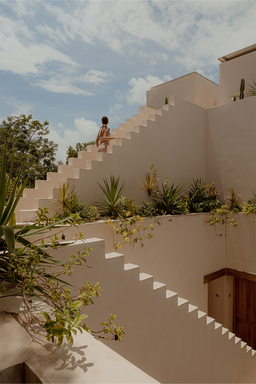 stacked chukum & stone volumes wrapped in green terraces shape RA!'s residences in tulum