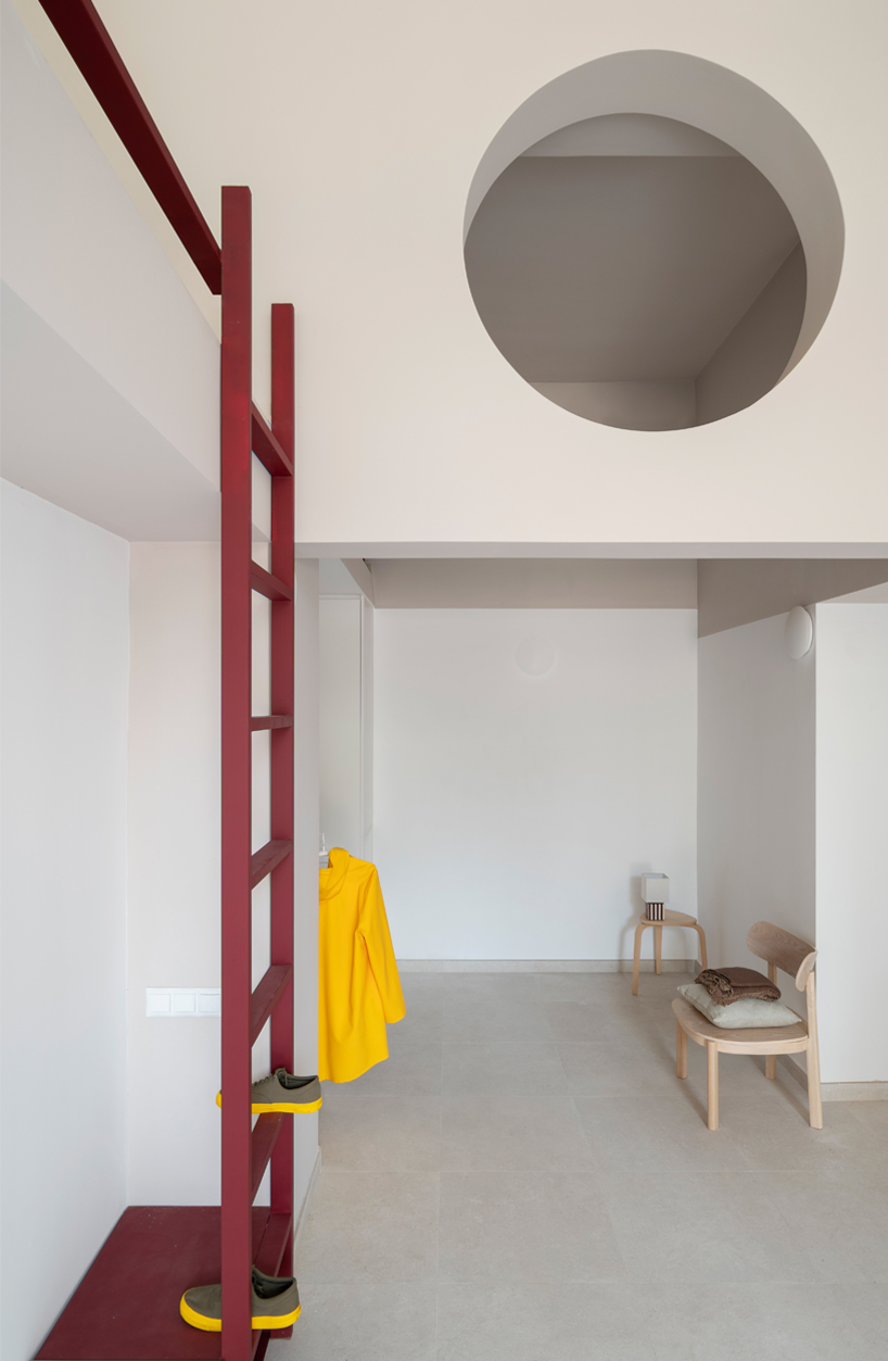 garnet-red accents and high clerestories punctuate AA Apartments in málaga - 6