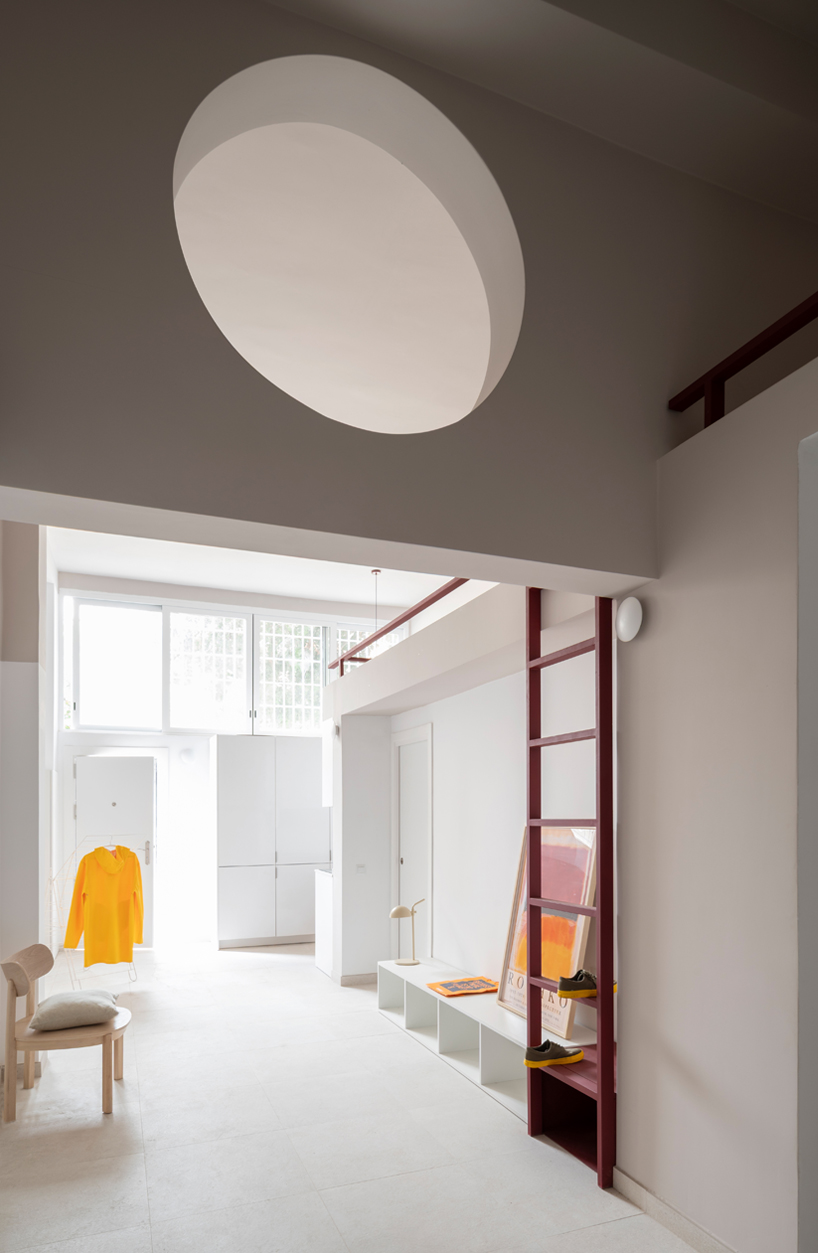 garnet-red accents and high clerestories punctuate AA Apartments in málaga - 7
