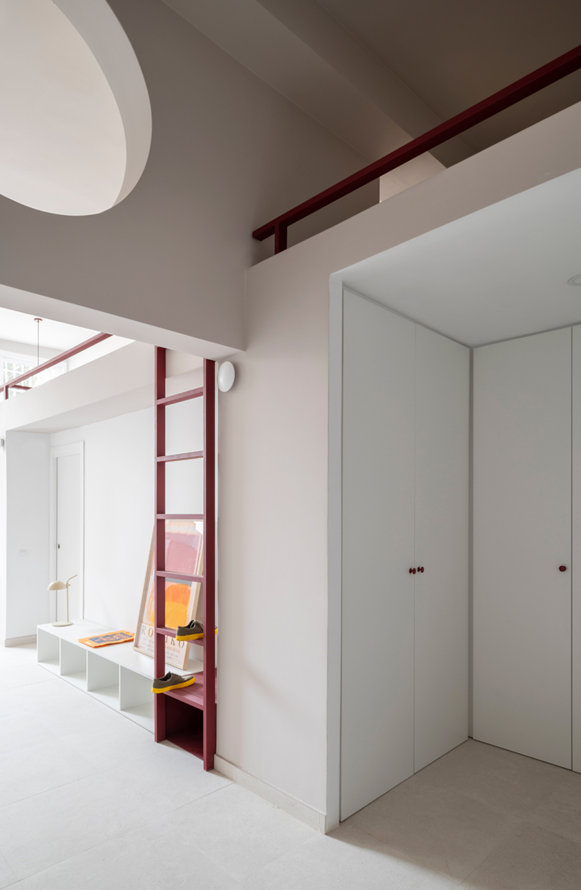 garnet-red accents and high clerestories punctuate AA Apartments in málaga - 8
