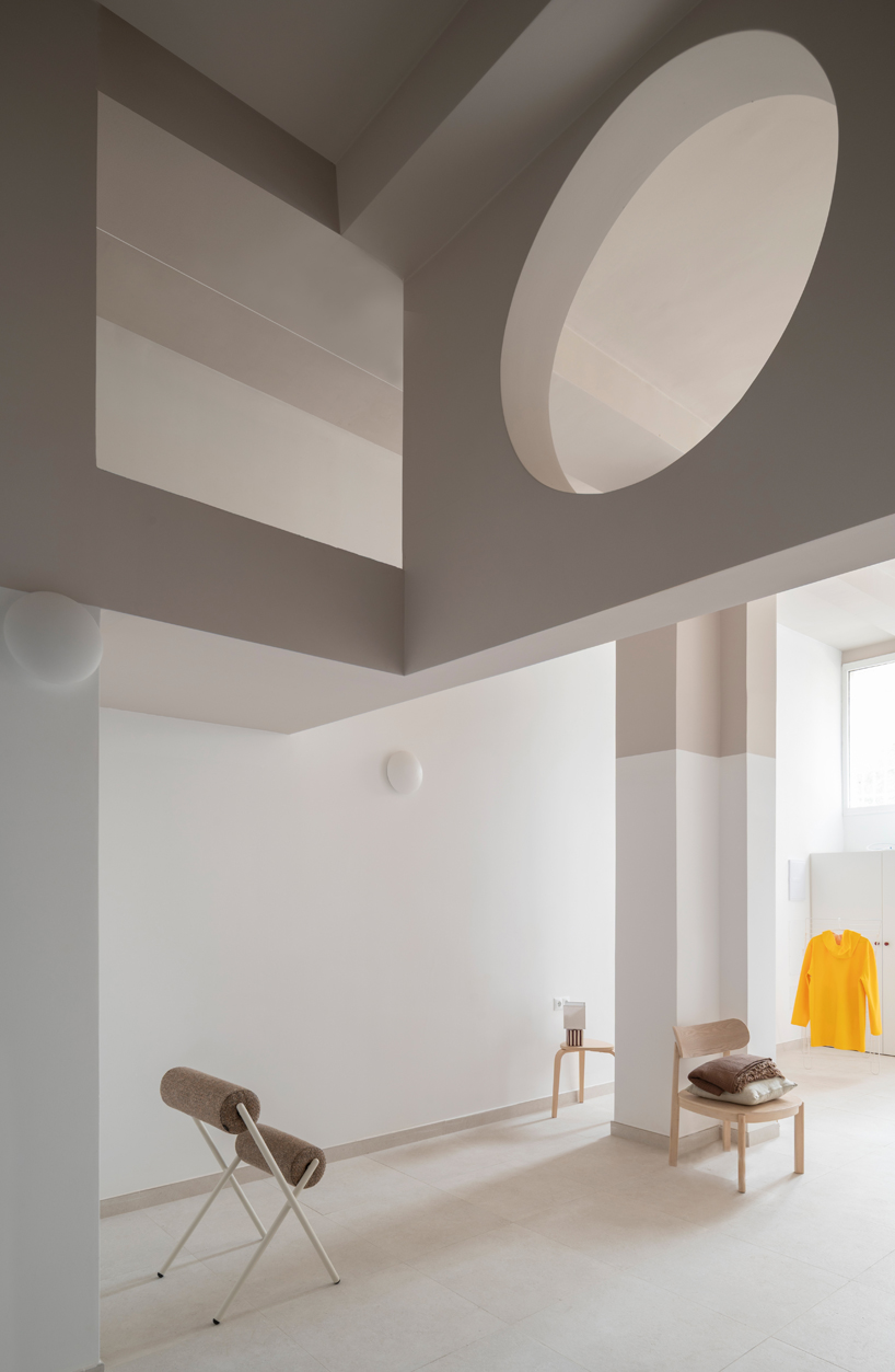 garnet-red accents and high clerestories punctuate AA Apartments in málaga - 9