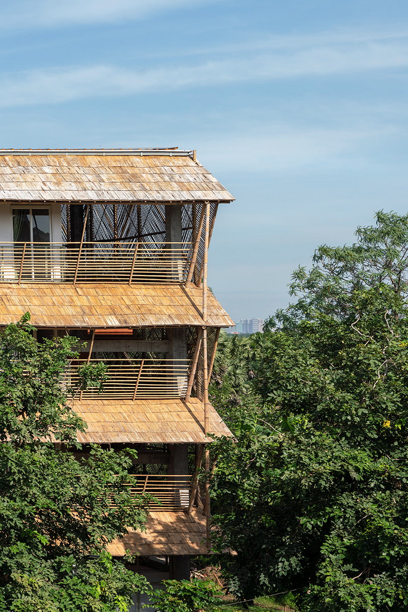 BLOOM screens girl dormitory's concrete skeleton with woven bamboo skin