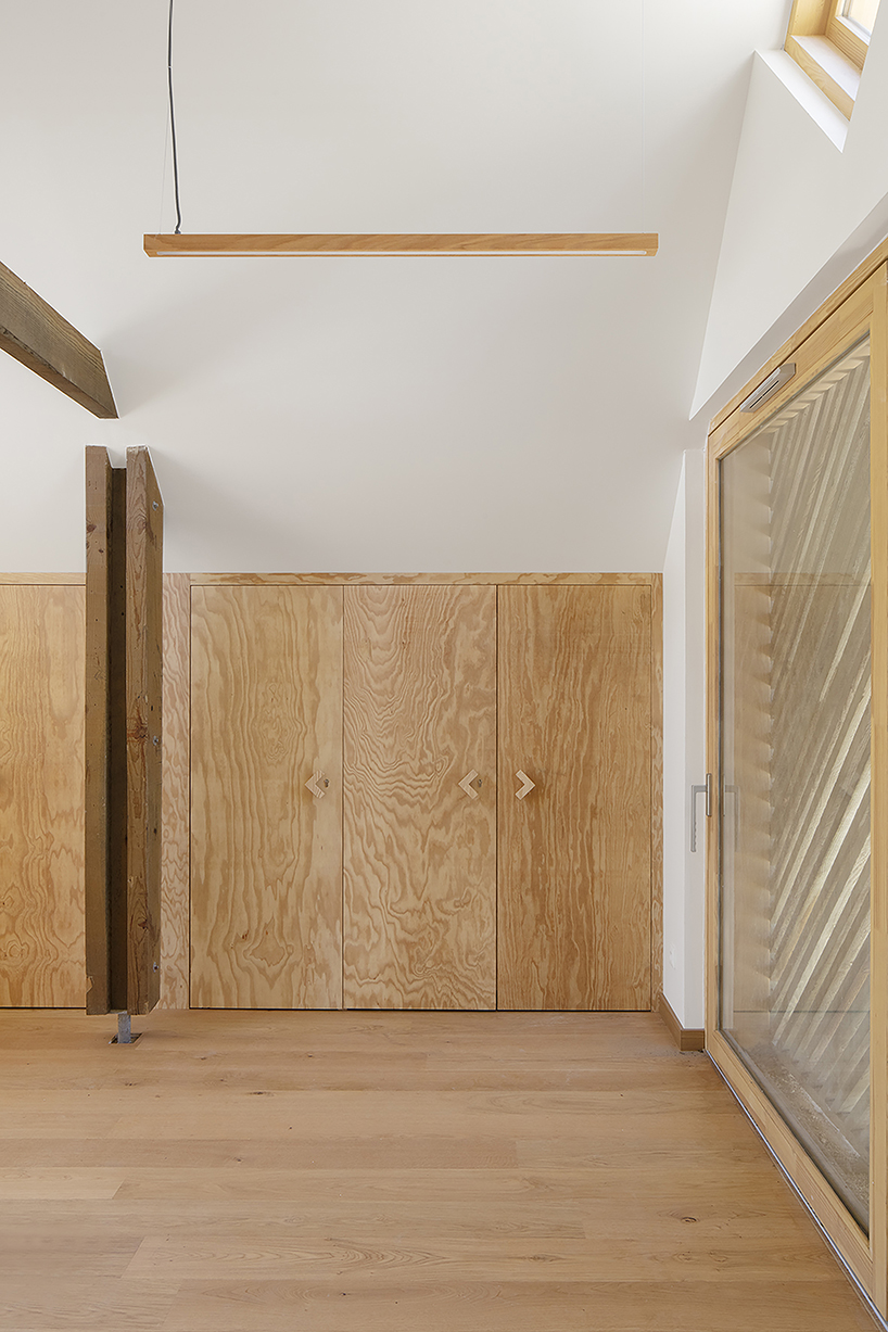 patterned repurposed timber panels clad grande dune du pilat visitor center's huts in france