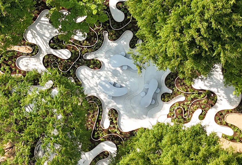 layered maze-like public garden coils around river park's trees in seoul