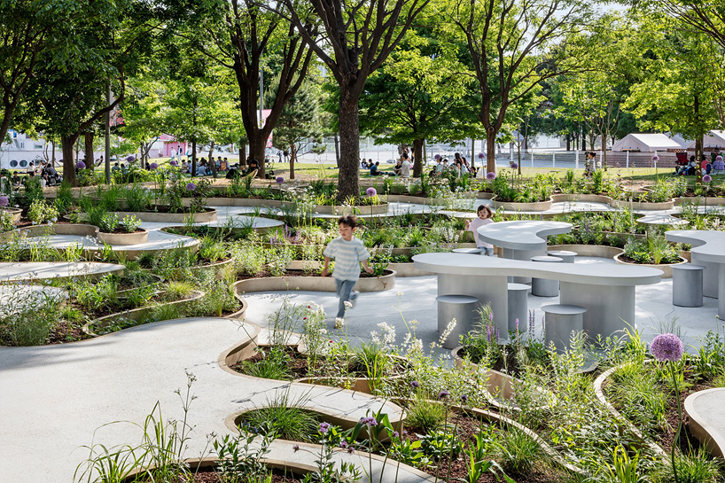 layered maze-like public garden coils around river park's trees in seoul