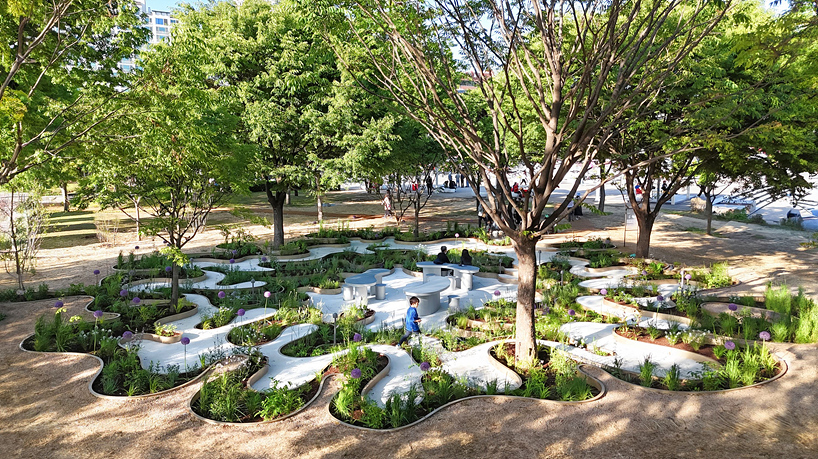 layered maze-like public garden coils around river park's trees in seoul