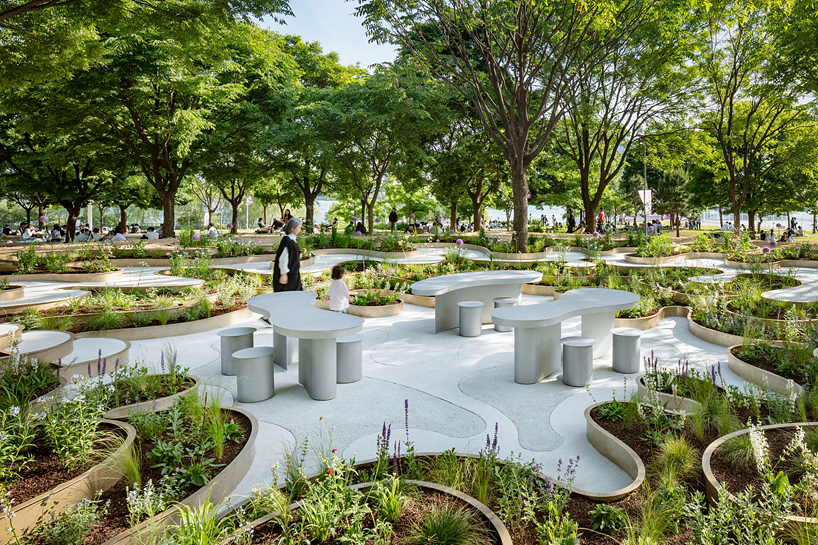 layered maze-like public garden coils around river park's trees in seoul