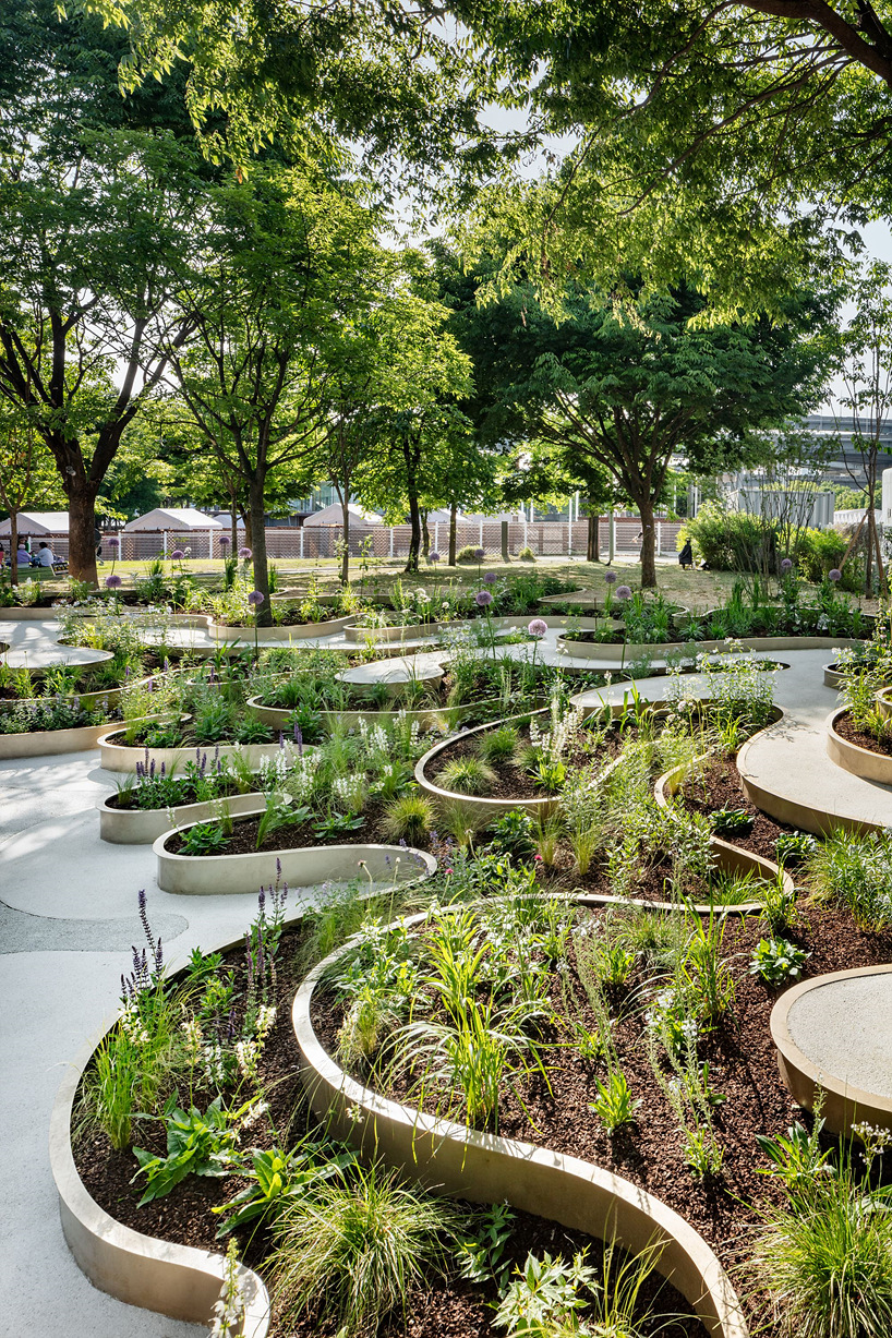 layered maze-like public garden coils around river park's trees in seoul