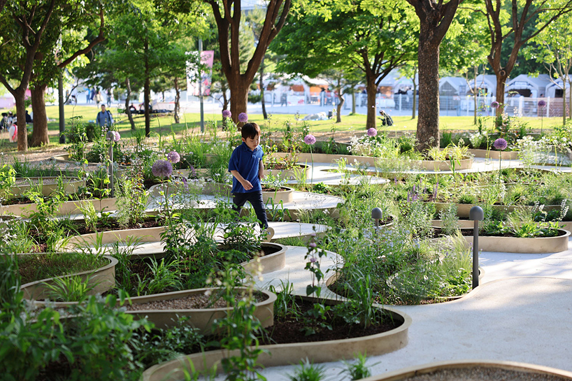 layered maze-like public garden coils around river park's trees in seoul