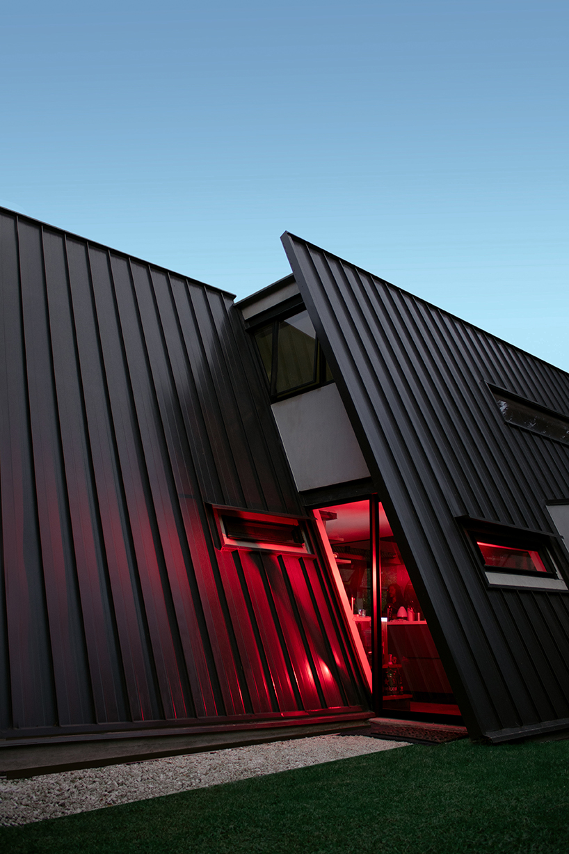 black metal panels form A-frame roof atop 1028arq's casa s in ecuador