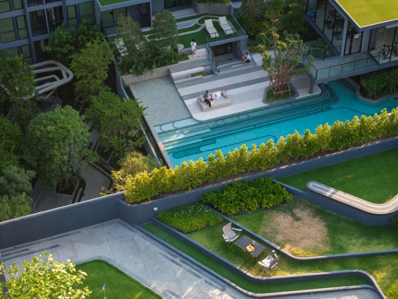 fingerprint patterns inform sculptural landscape design within bangkok housing complex