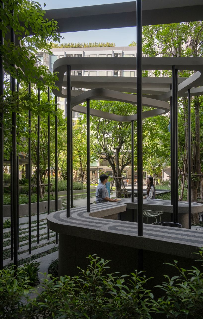 fingerprint patterns inform sculptural landscape design within bangkok housing complex