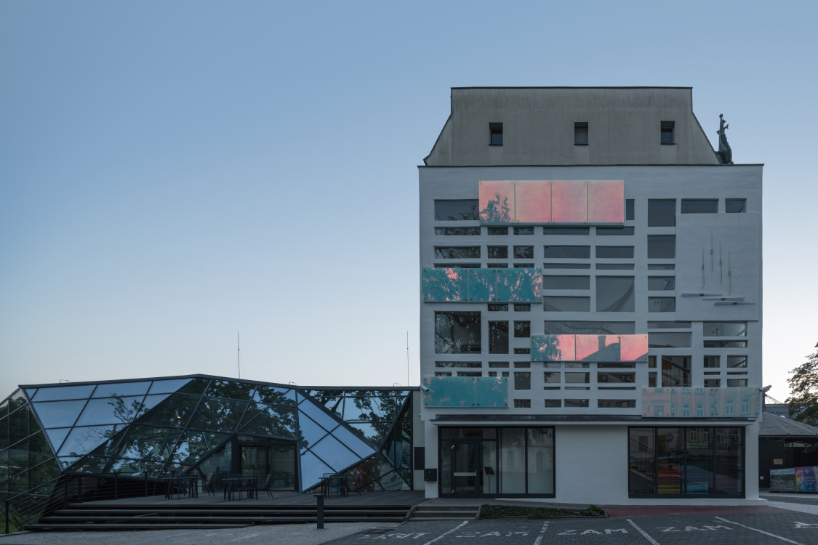 dichroic glass collage by tereza šváchová wraps museum staircase in czech republic