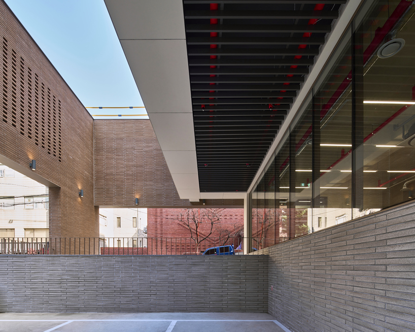 stepped facade extended from brick base in mixed-use building by mlnp architects in Seoul