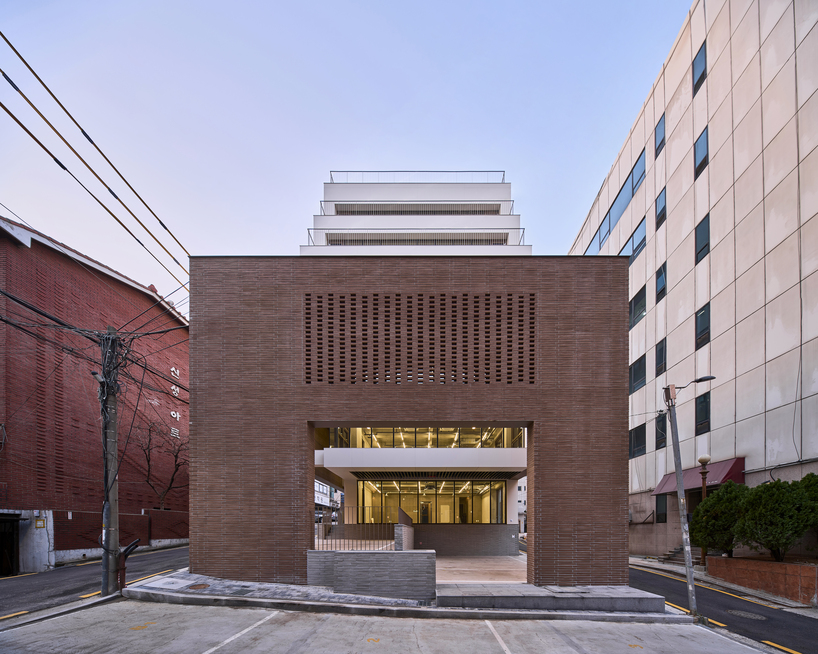 stepped facade extended from brick base in mixed-use building by mlnp architects in Seoul