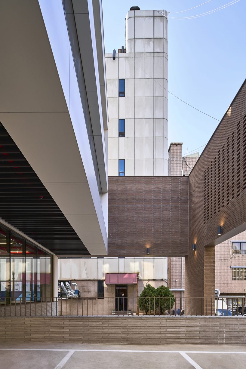 stepped facade extended from brick base in mixed-use building by mlnp architects in Seoul