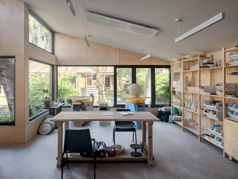 ceramic artist's wood-clad studio extends 80s-built house in the UK