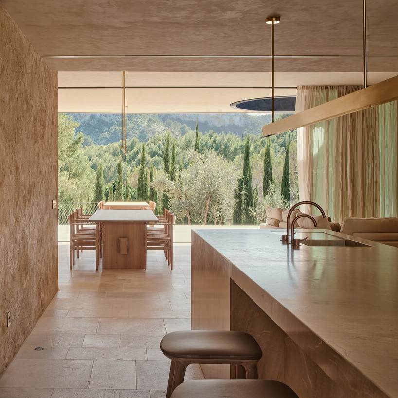 circular roof opening brings sunlight into casa óculo by OHLAB in palma - 7