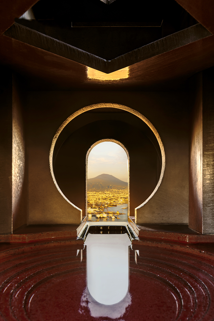 totemic sculptures compose volcanic stone landscape for site-specific installation in naples