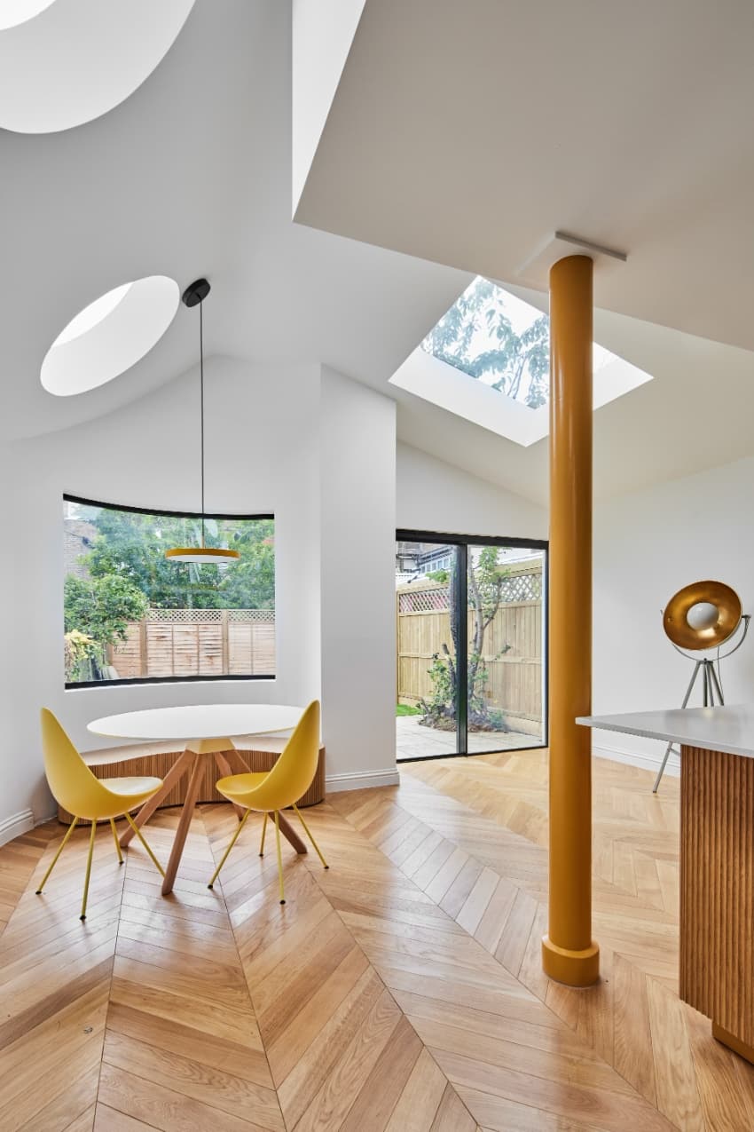 a series of square and circular skylights introduces geometric light casts within minty house