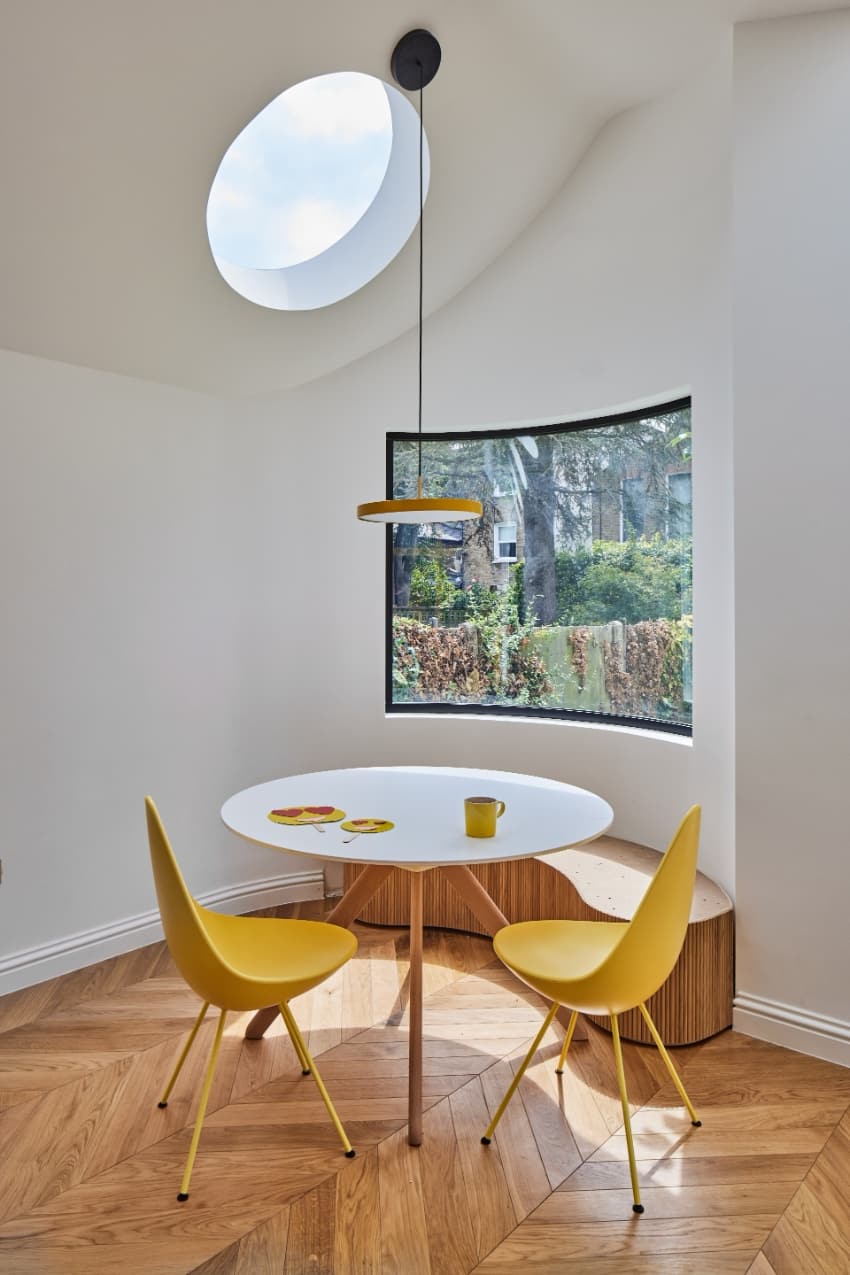 a series of square and circular skylights introduces geometric light casts within minty house