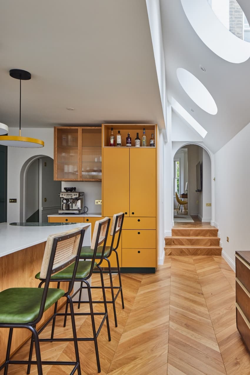 a series of square and circular skylights introduces geometric light casts within minty house