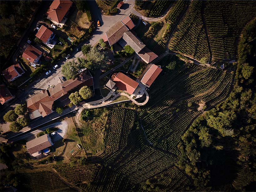 belvedere's wooden promenade by collection architectes floats above vineyards in france