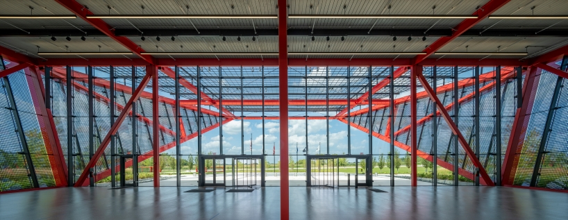 bright red steel frame outlines pritzker military archives center by jahn/ in wisconsin
