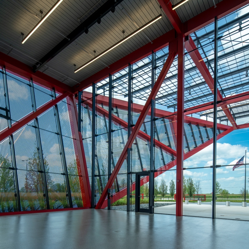 bright red steel frame outlines pritzker military archives center by jahn/ in wisconsin