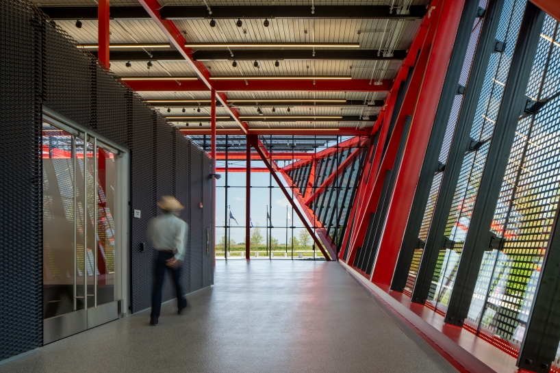 bright red steel frame outlines pritzker military archives center by jahn/ in wisconsin