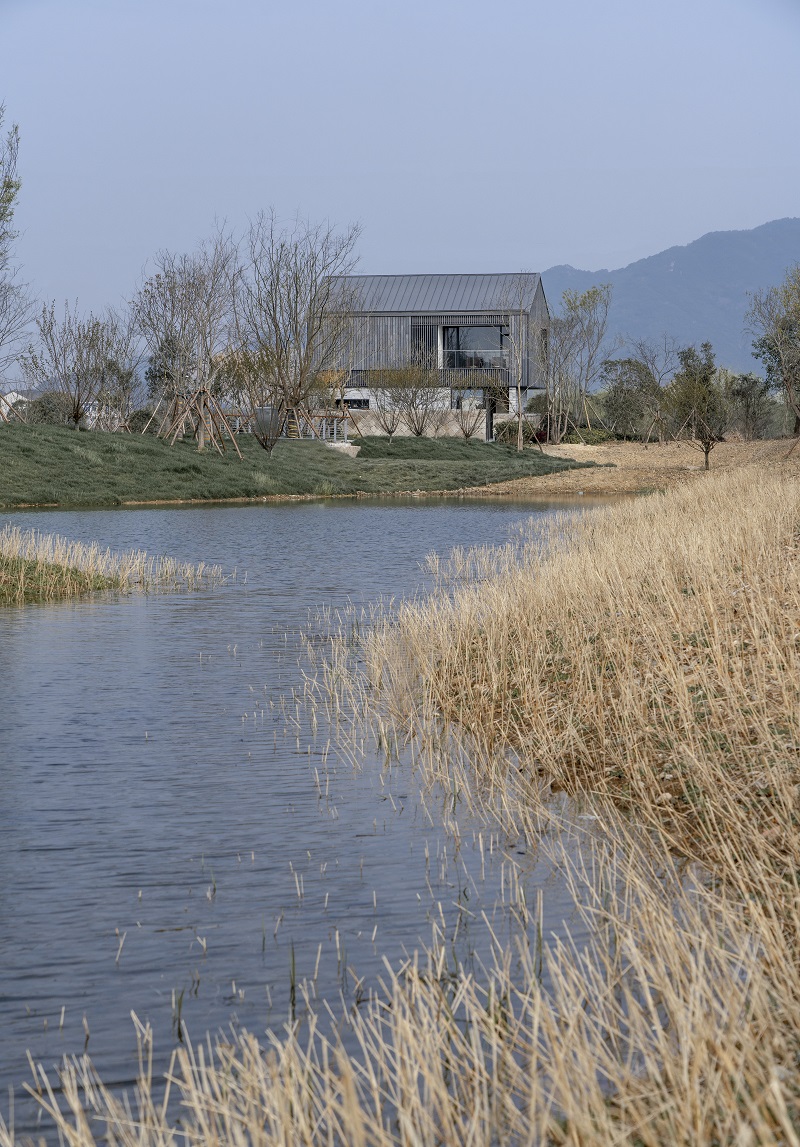 yakisugi wood and stone scraps wrap levels of urbanfabric design's cabin in china wetlands