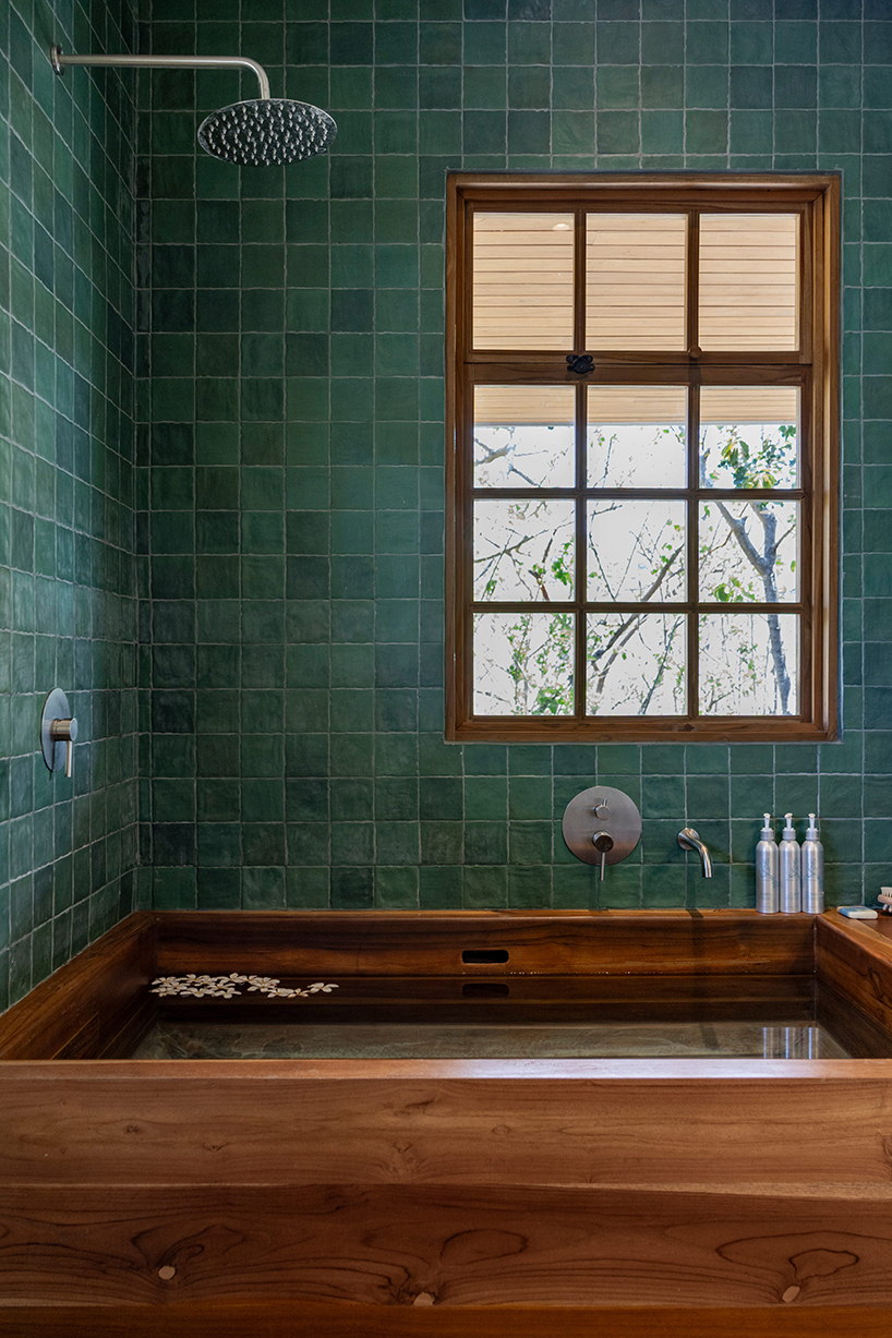 recycled ocean-plastic tiles, timber, and stone shape tropical house on costa rica’s coast - 8