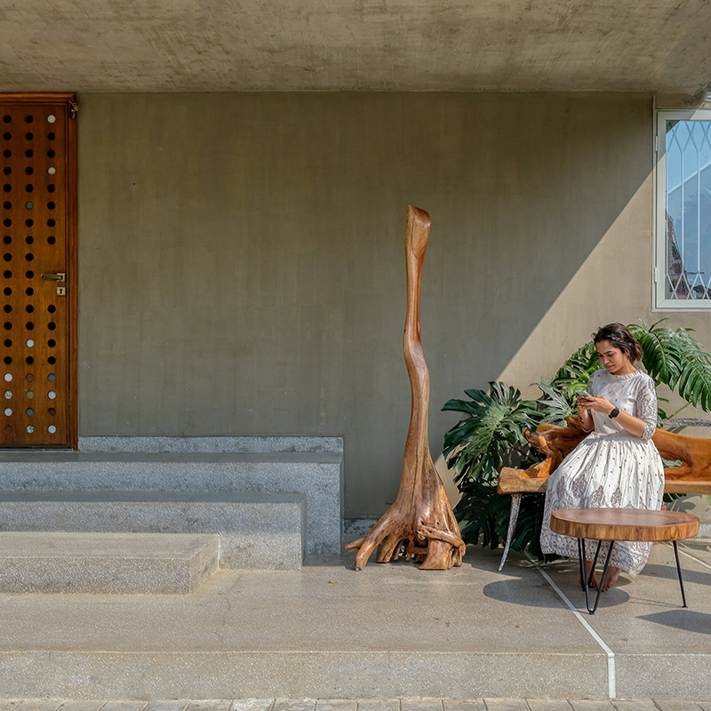 breathable stone facade by maanchitra enfolds family residence in rural india