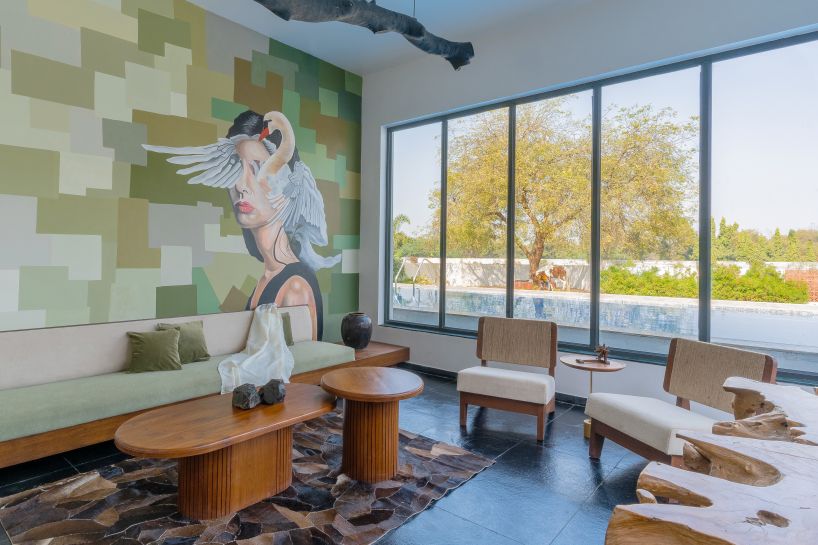 linear, unbroken wall encloses weekend villa by maanchitra in rural india